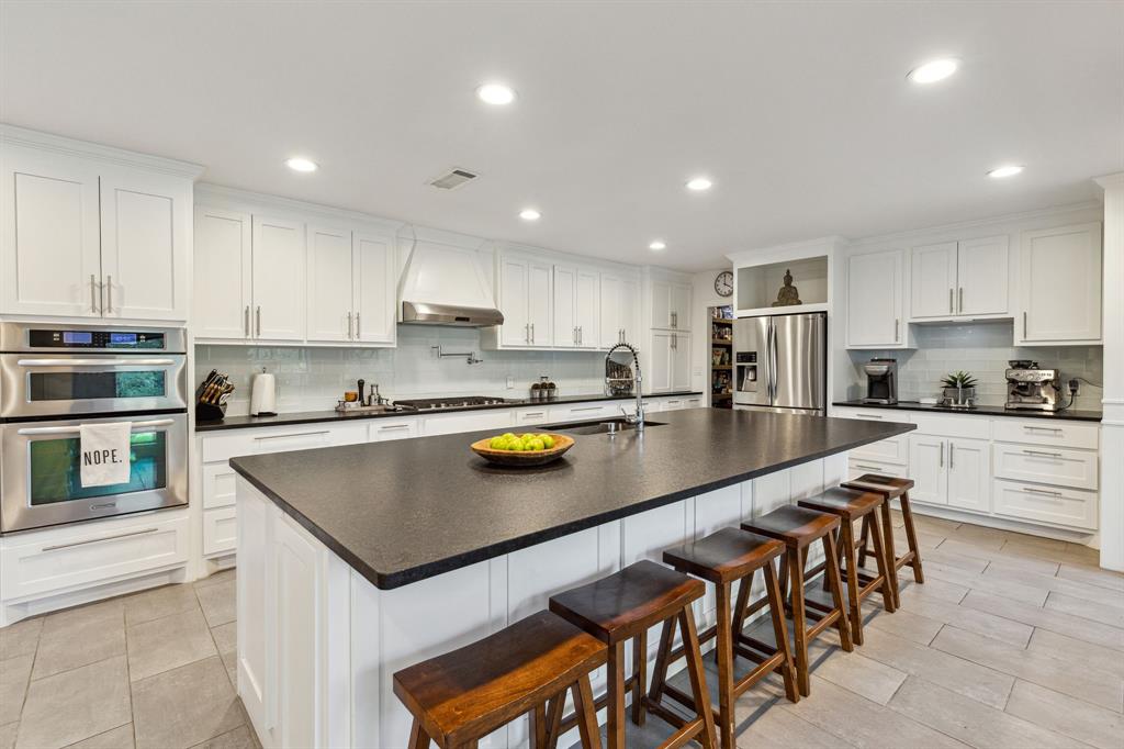 7342 Briar Road Azle, TX 76020 - Photo 6 of 40 Kitchen featuring custom cabinets with plenty of storage and sitting space for entertainment