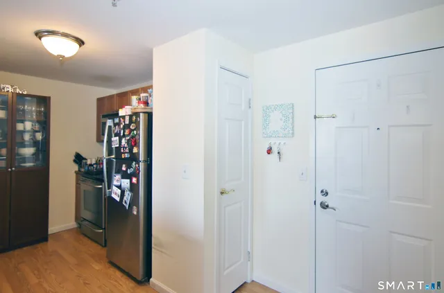 a kitchen with stainless steel appliances granite countertop a sink and cabinets