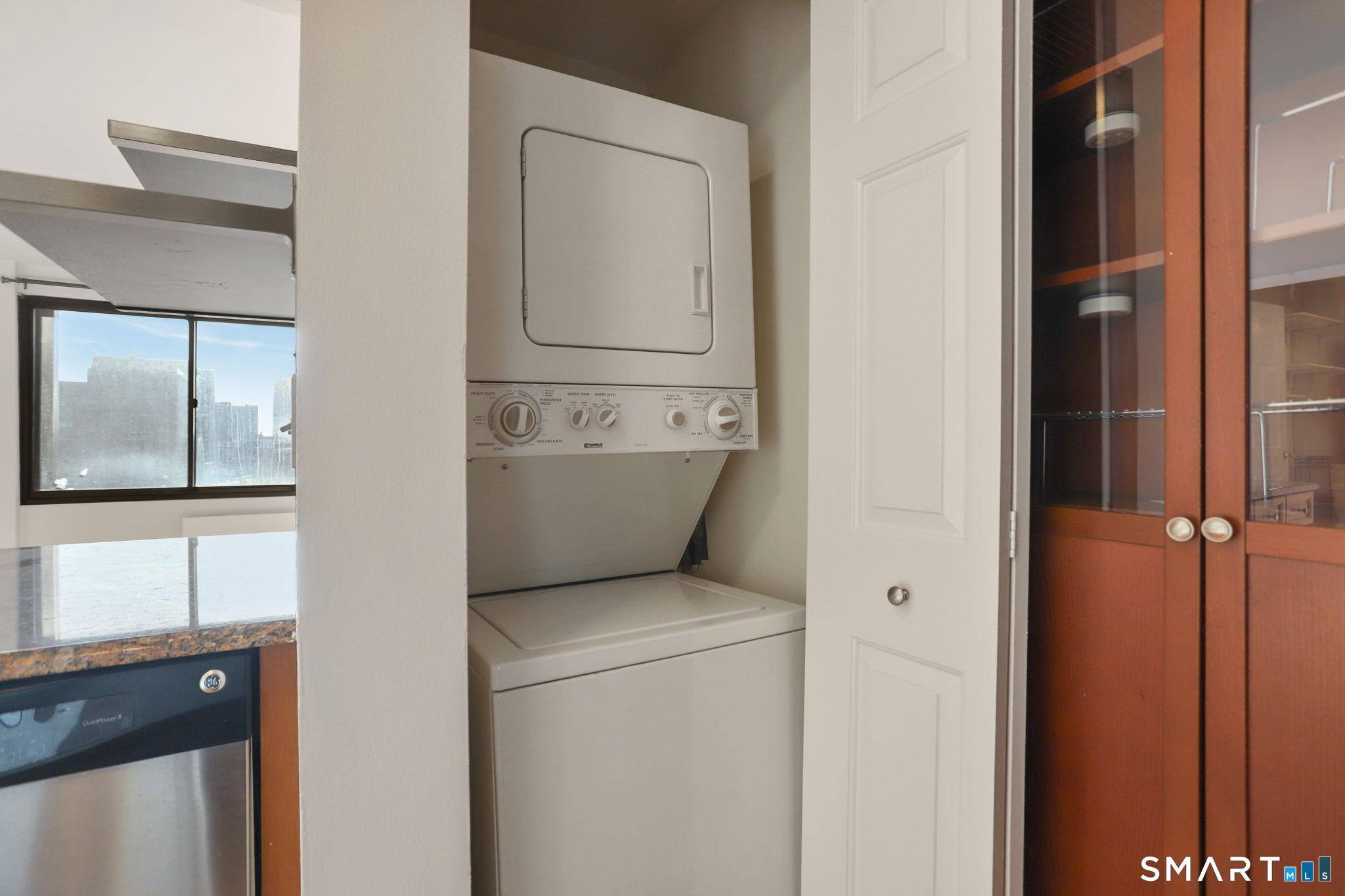 300 Broad Street, Unit 603 Stamford, CT 06901 - Photo 6 of 20 a utility room with closet dryer and washer