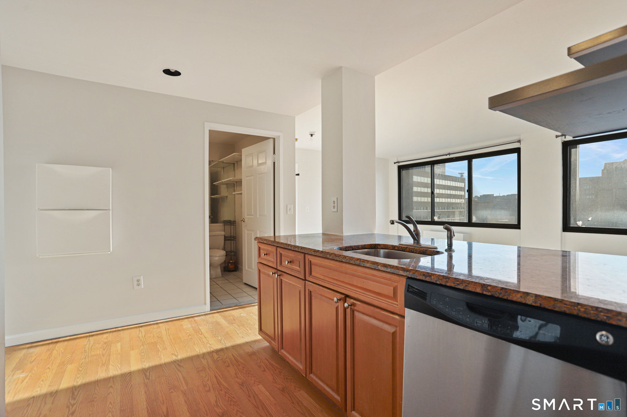300 Broad Street, Unit 603 Stamford, CT 06901 - Photo 7 of 20 a kitchen with a sink and a window