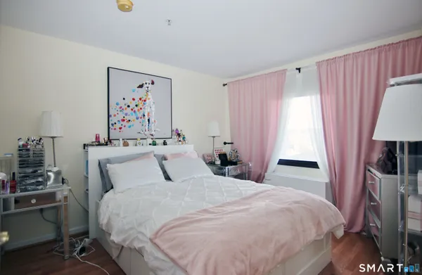 a bedroom with a bed and a table in it