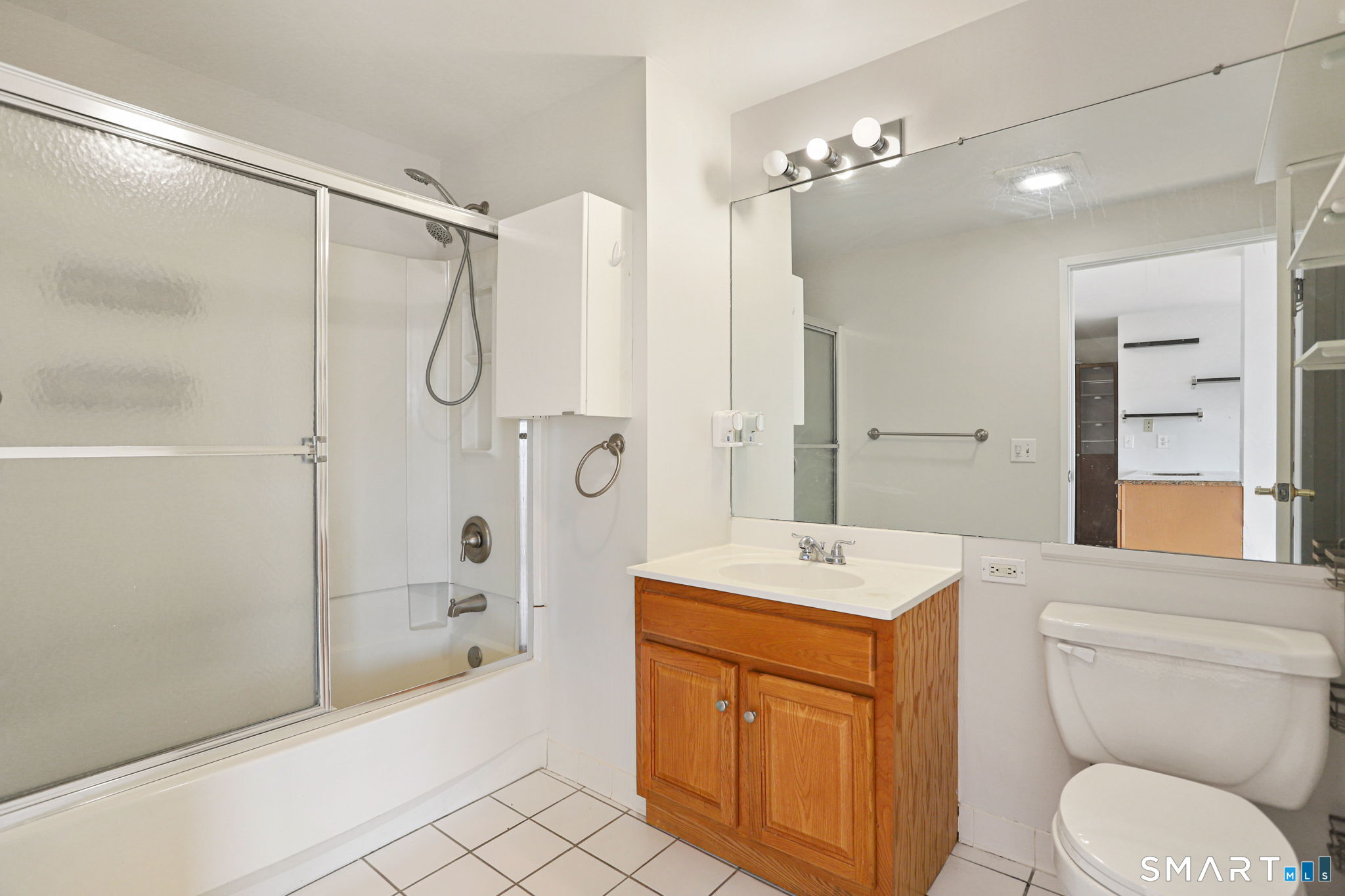300 Broad Street, Unit 603 Stamford, CT 06901 - Photo 9 of 20 a spacious bathroom with a shower sink vanity mirror and toilet