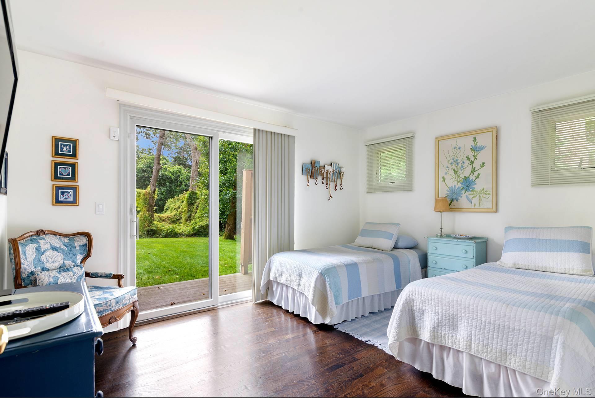 20 Cutter Court East Hampton, NY 11937 - Photo 12 of 18 a bedroom with two beds and a window