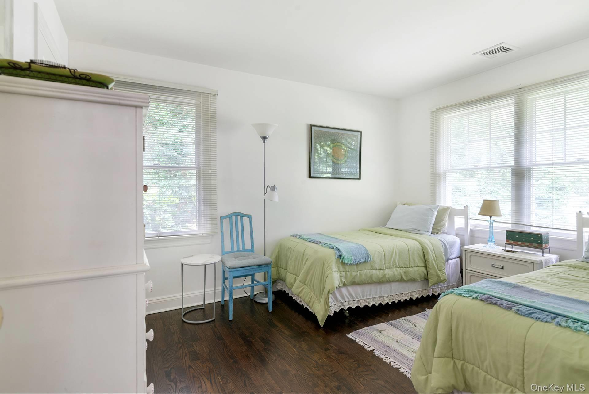 20 Cutter Court East Hampton, NY 11937 - Photo 15 of 18 a bedroom with two beds and a window
