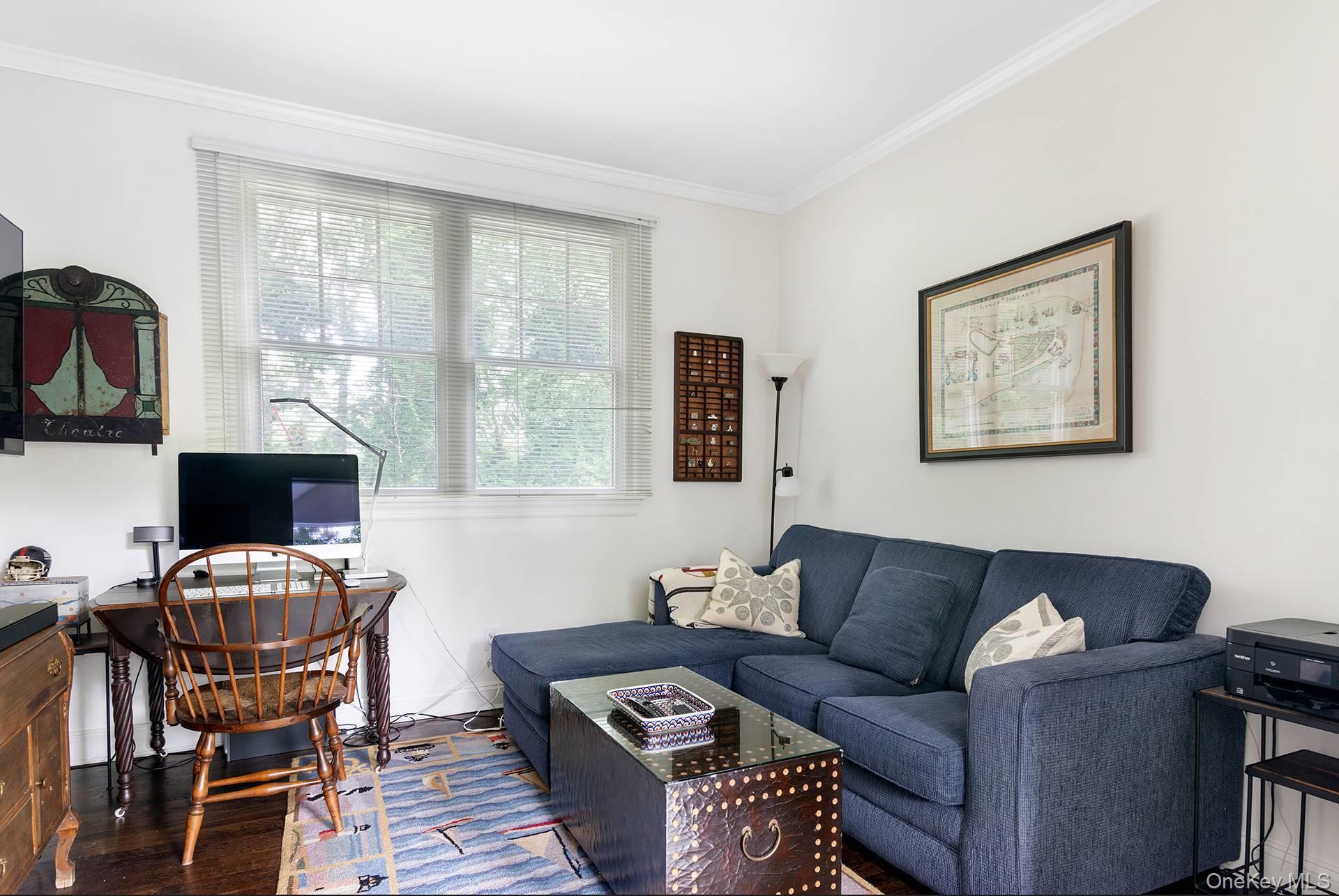 20 Cutter Court East Hampton, NY 11937 - Photo 17 of 18 a living room with furniture and a flat screen tv