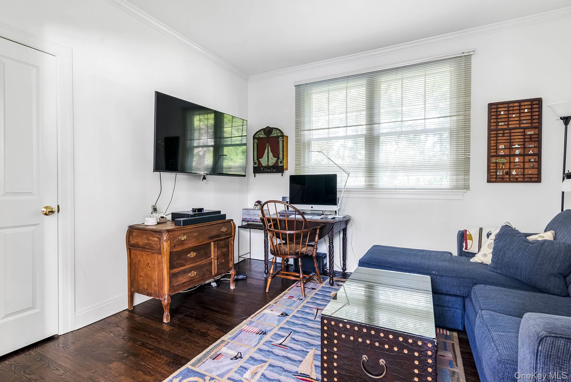 20 Cutter Court East Hampton, NY 11937 - Photo 18 of 18 a view of a livingroom with workspace and a window
