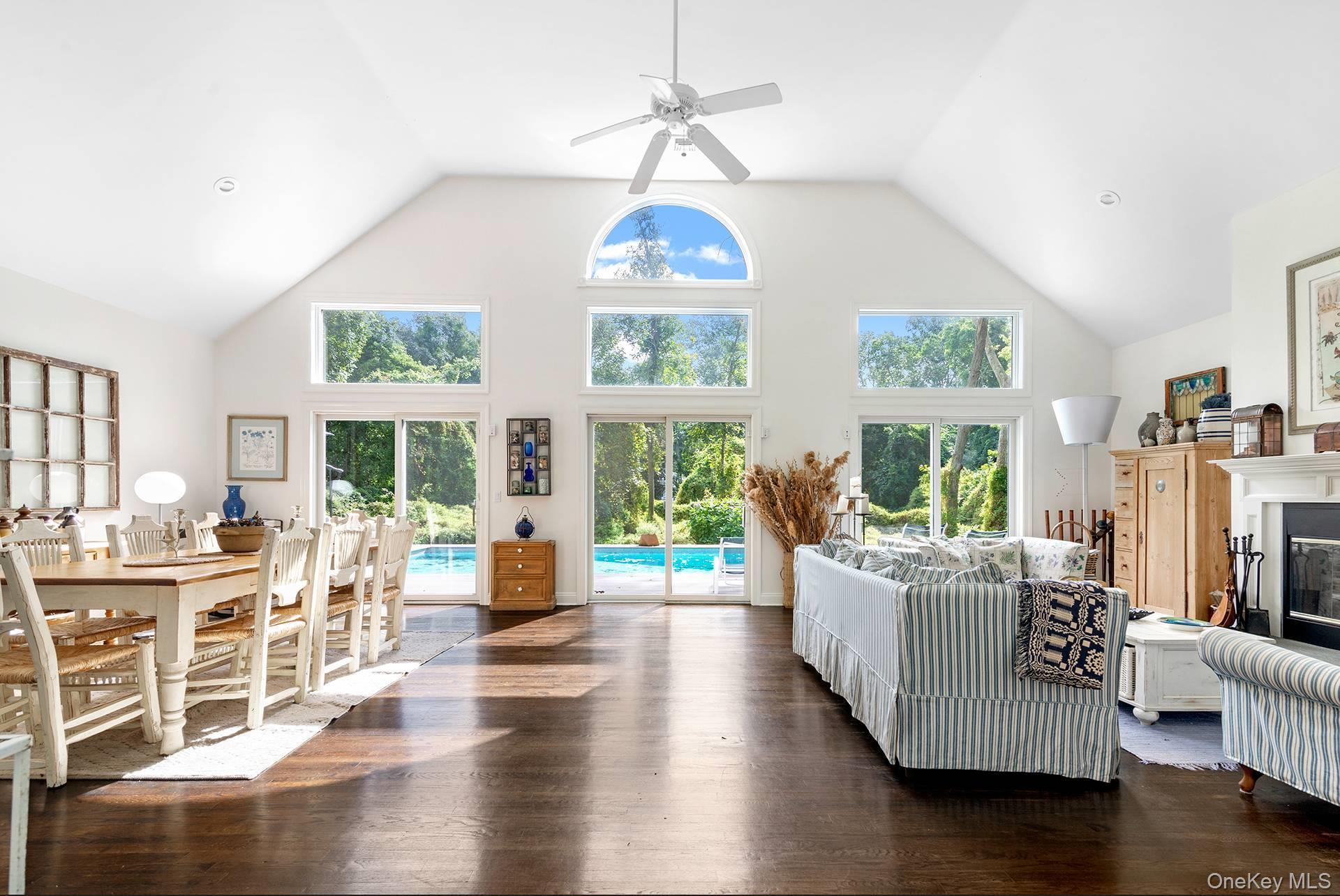 20 Cutter Court East Hampton, NY 11937 - Photo 5 of 18 a living room with furniture fireplace and large windows