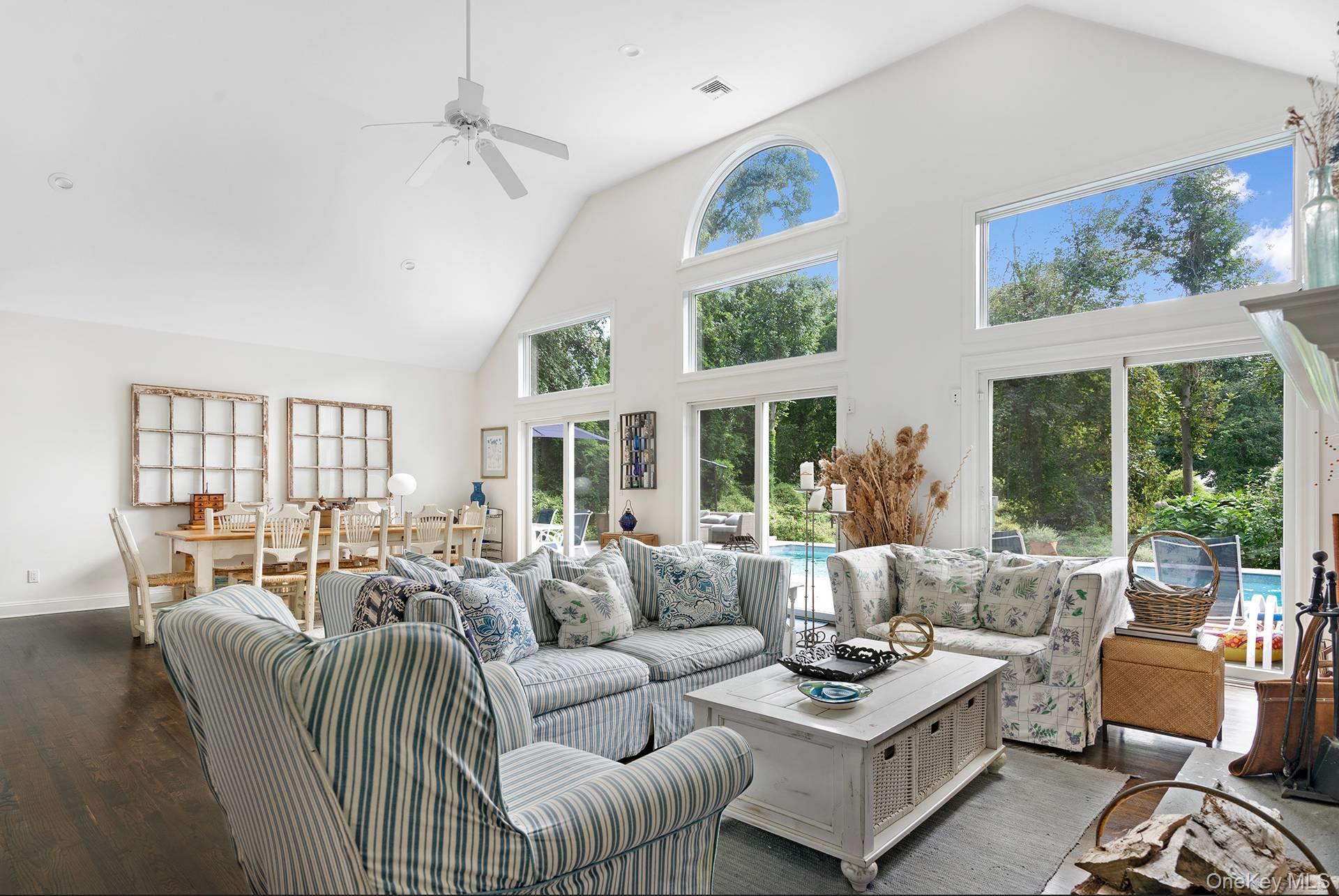 20 Cutter Court East Hampton, NY 11937 - Photo 6 of 18 a living room with furniture and large windows