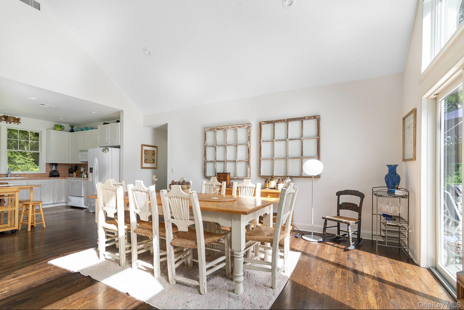 20 Cutter Court East Hampton, NY 11937 - Photo 7 of 18 a view of a dining room with furniture and wooden floor