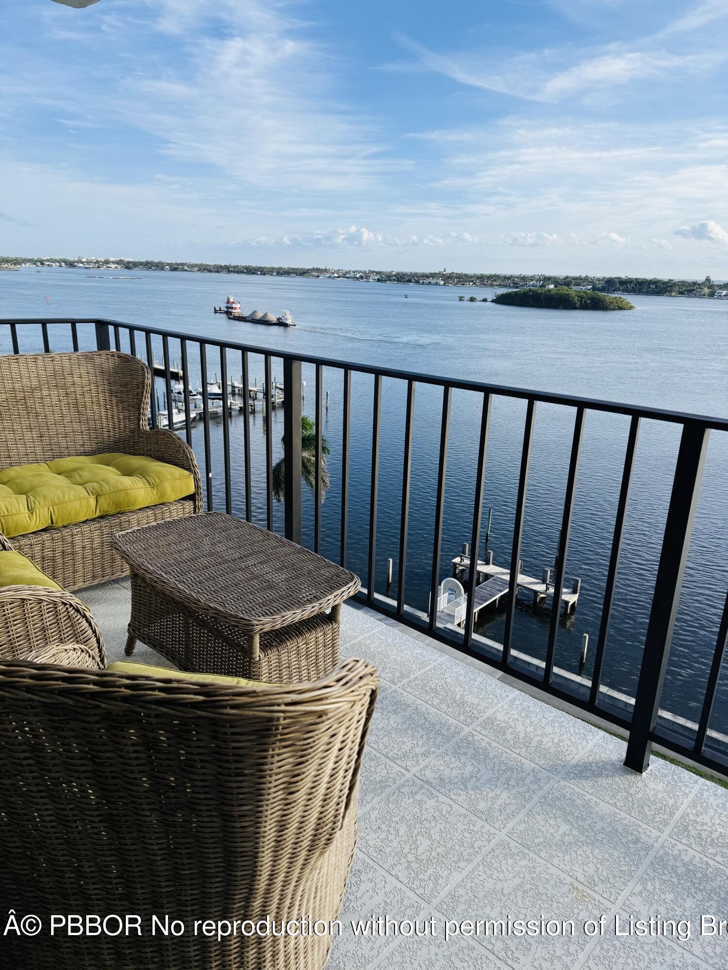 3800 Washington Road, Unit 907 West Palm Beach, FL 33405 - Photo 6 of 8 a view of a balcony with chairs