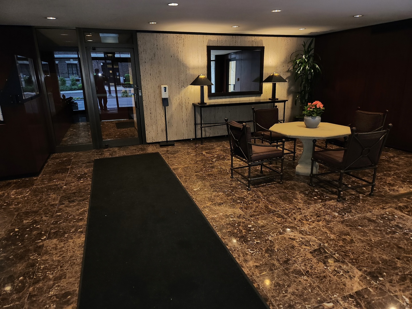 1 East Scott Street, Unit 601 Chicago, IL 60610 - Photo 2 of 15 a living room with chairs and a table