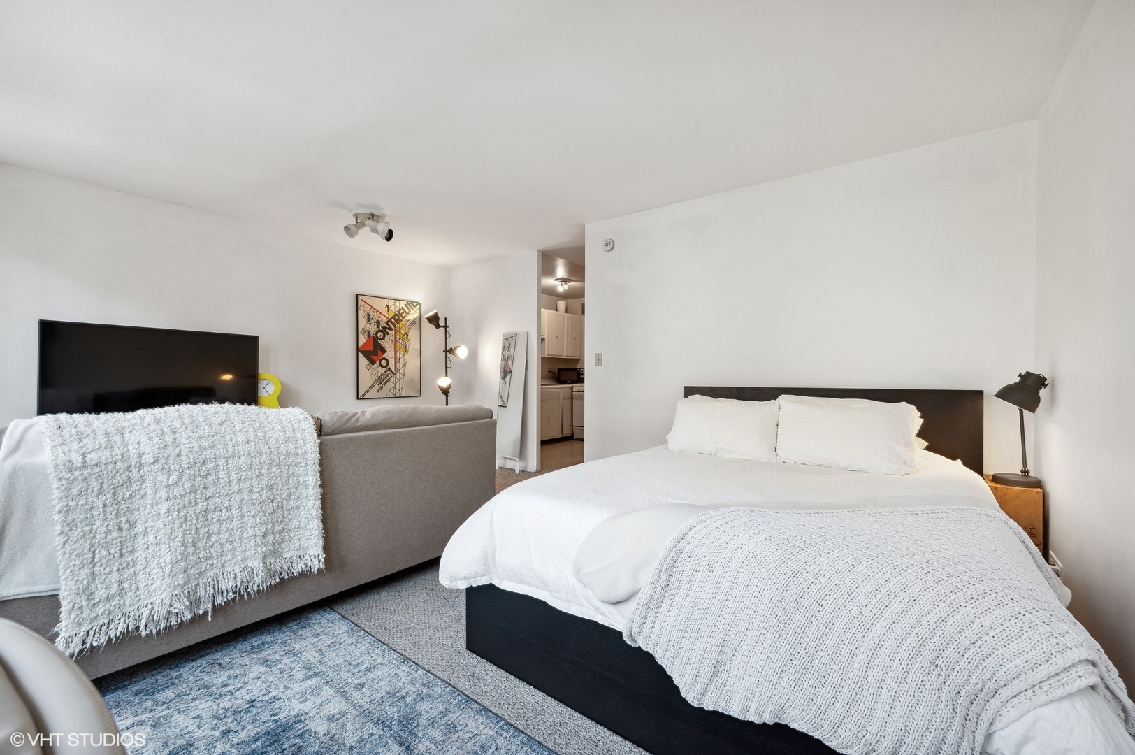 1 East Scott Street, Unit 601 Chicago, IL 60610 - Photo 10 of 15 a bedroom with a bed and a television