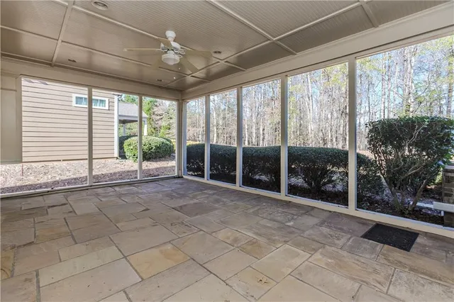 a view of an empty room with windows