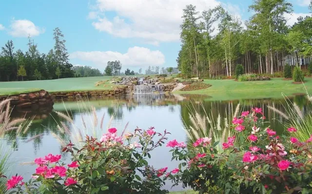 a view of a swimming pool with outdoor seating