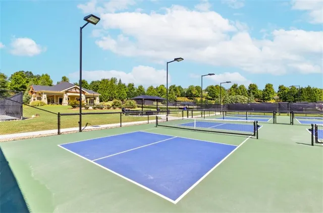 an aerial view of a house with outdoor space patio and lake view