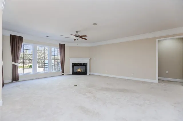 a view of an empty room with a fireplace