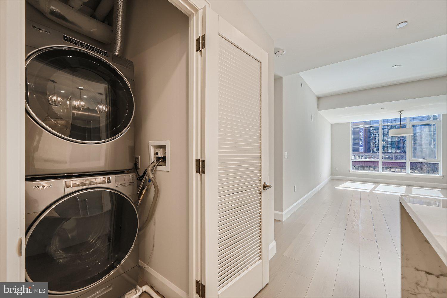 1330 Lancaster Street, Unit C302 Baltimore, MD 21231 - Photo 23 of 41 a view of a hallway with washer and dryer