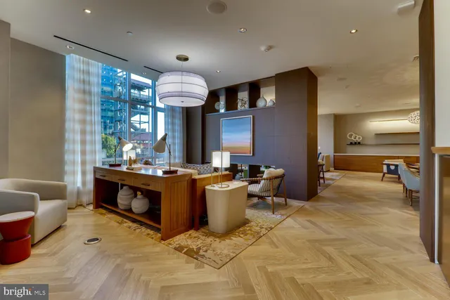 a living room with furniture window and wooden floor