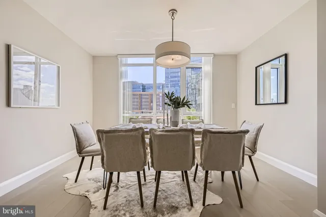 a view of a dining room with furniture window and outside view