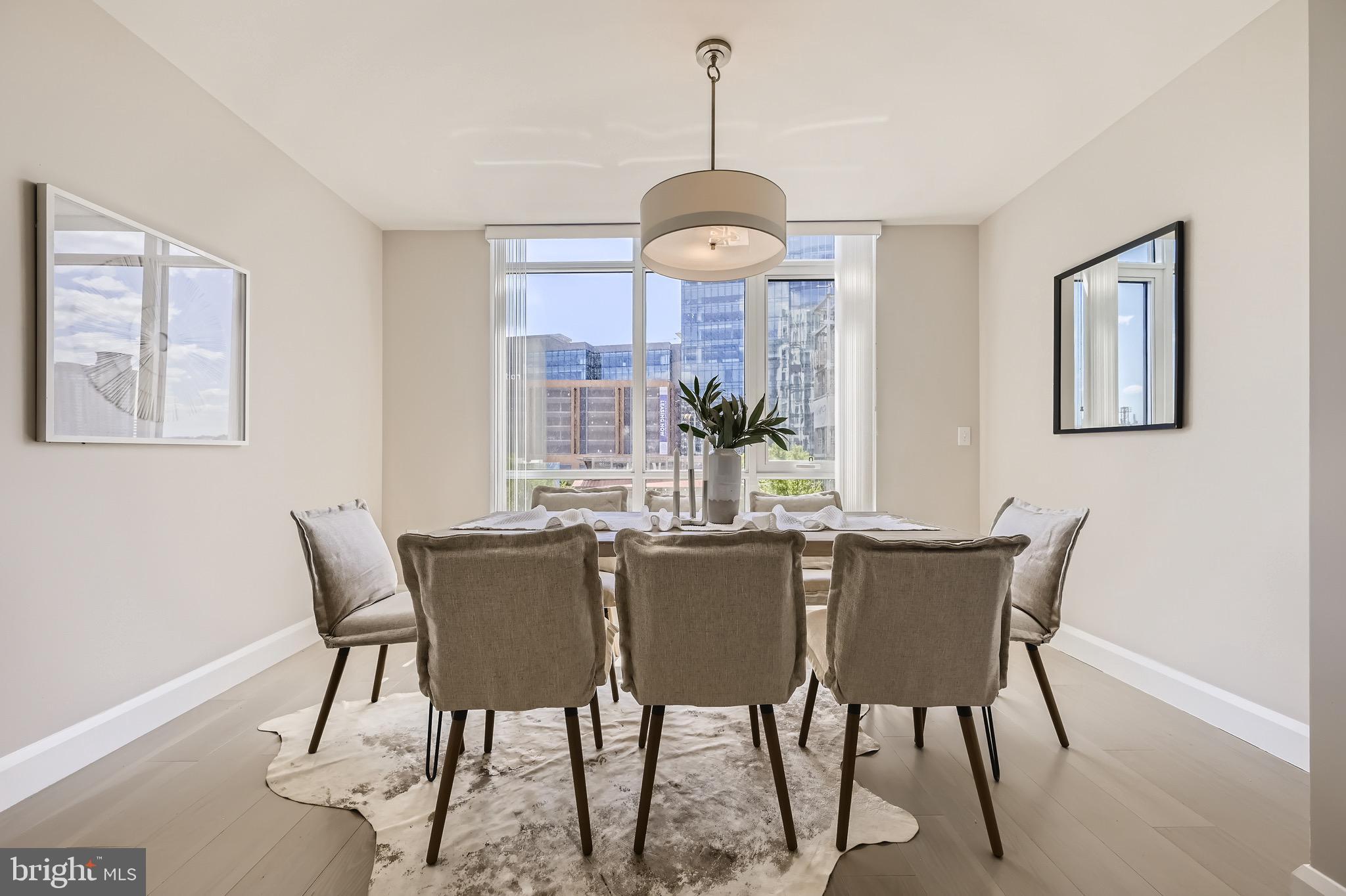 1330 Lancaster Street, Unit C302 Baltimore, MD 21231 - Photo 7 of 41 a view of a dining room with furniture window and outside view