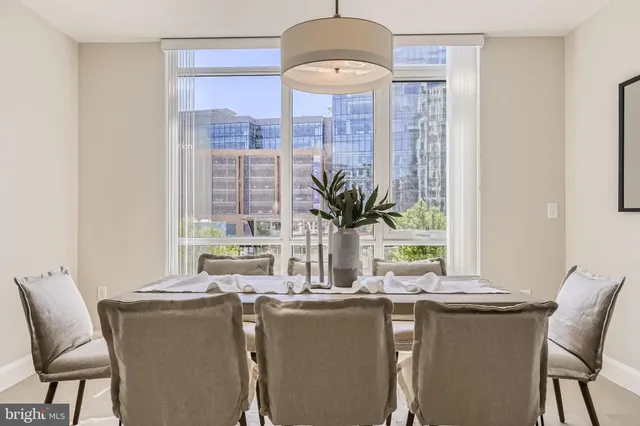 a dining room with furniture and window