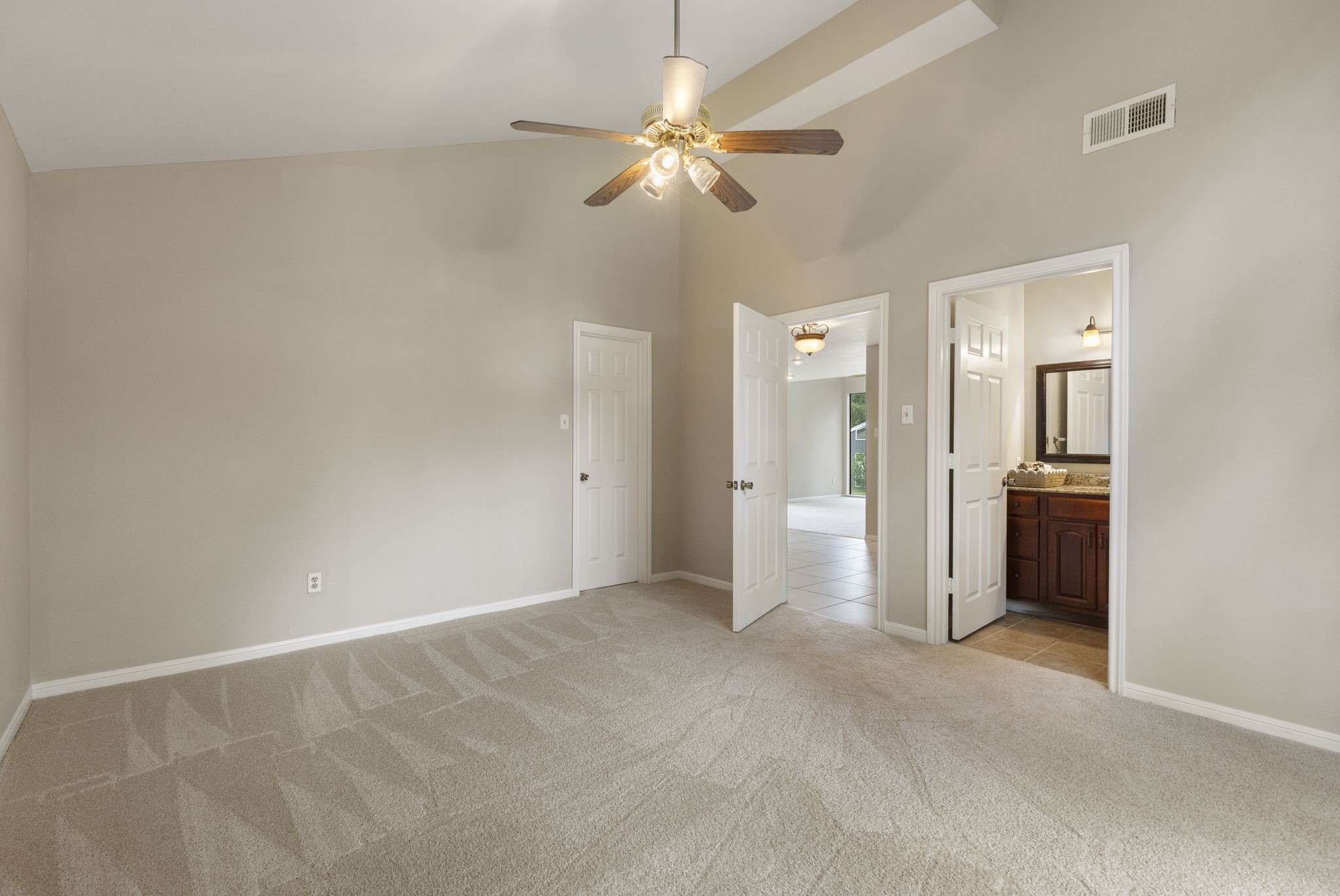 49 April Village Conroe, TX 77356 - Photo 23 of 46 an empty room with fan and entrance