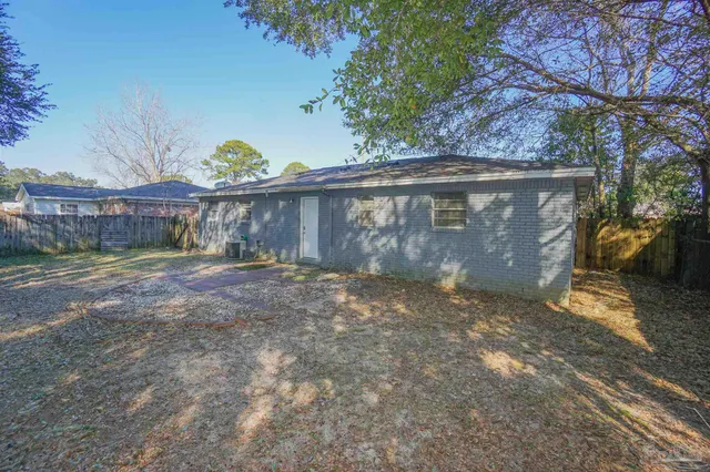 a view of a street with a tree in front of it