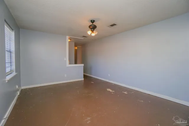 a view of an empty room with a window