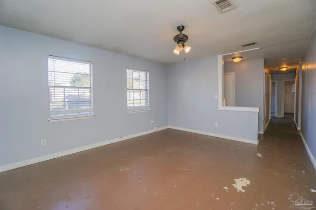 a view of an empty room with a window