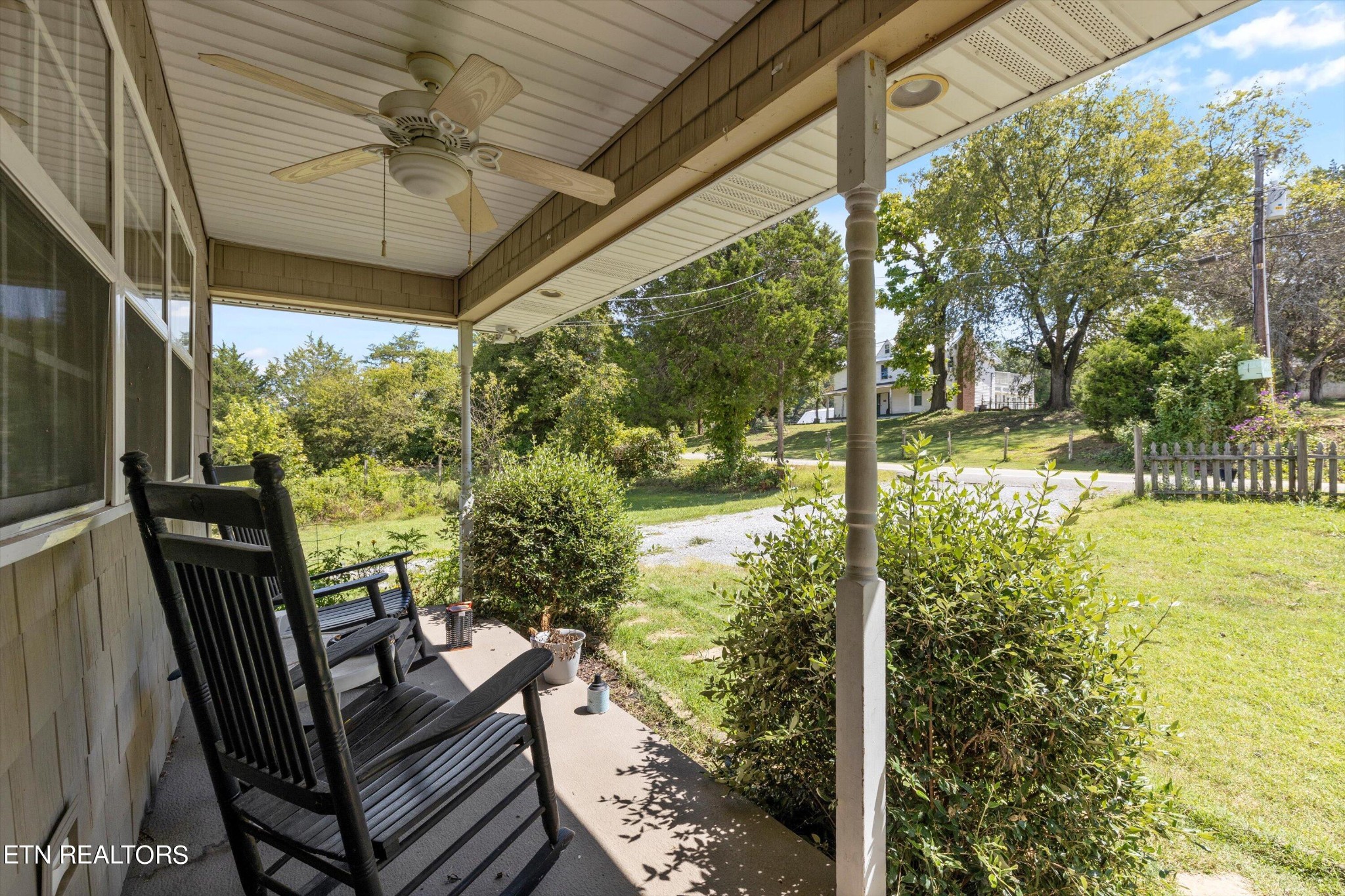 2650 Niles Ferry Road Greenback, TN 37742 - Photo 4 of 36 a view of a porch with furniture and a yard