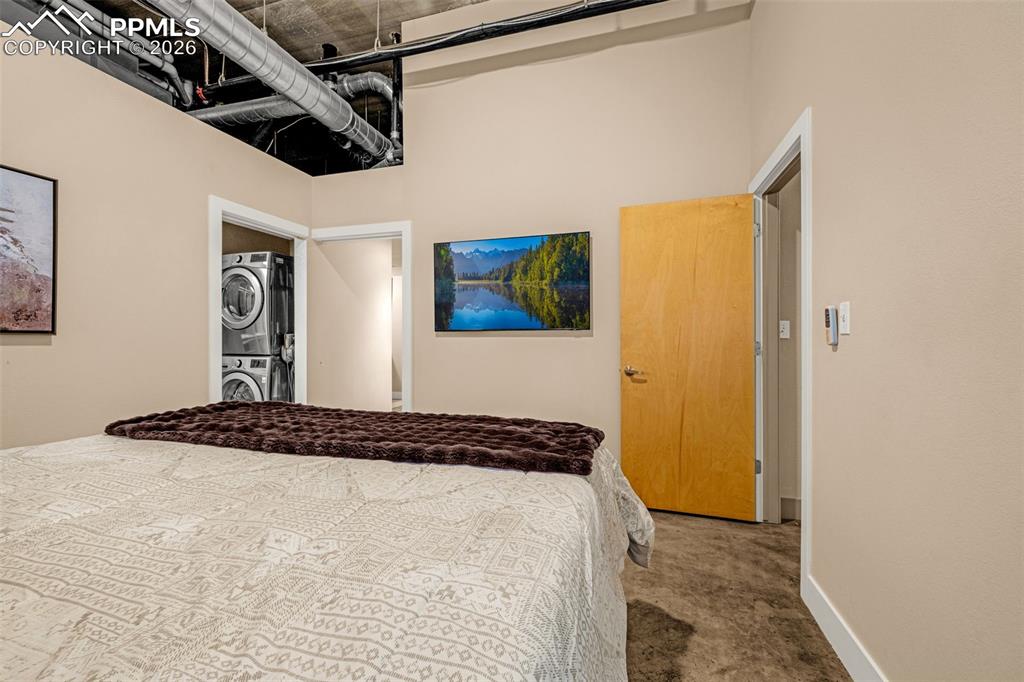 101 North Tejon Street, Unit 280 Colorado Springs, CO 80903 - Photo 16 of 32 a bedroom with a bed and a window