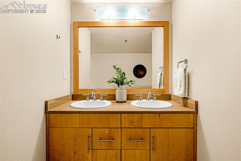 101 North Tejon Street, Unit 280 Colorado Springs, CO 80903 - Photo 18 of 32 a bathroom with a sink and a mirror