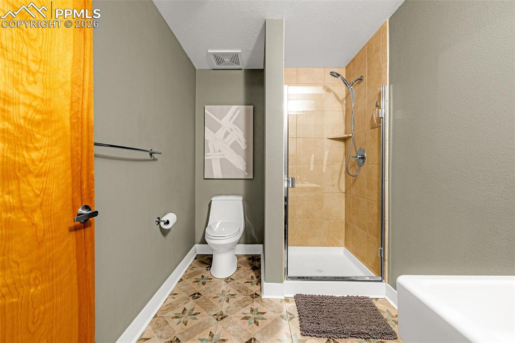 101 North Tejon Street, Unit 280 Colorado Springs, CO 80903 - Photo 25 of 32 a bathroom with a shower and a toilet