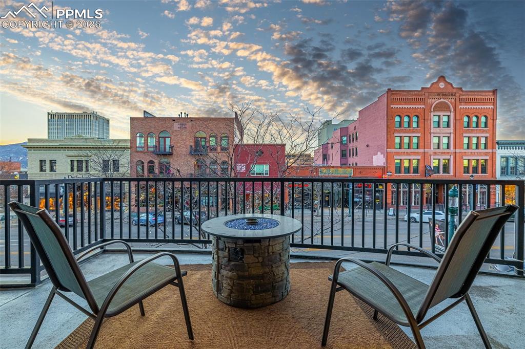101 North Tejon Street, Unit 280 Colorado Springs, CO 80903 - Photo 28 of 32 a view of a balcony with chair and wooden fence