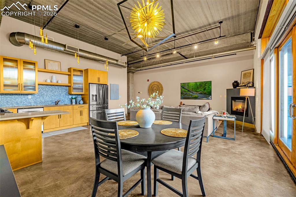 101 North Tejon Street, Unit 280 Colorado Springs, CO 80903 - Photo 5 of 32 a dining room with furniture and chandelier