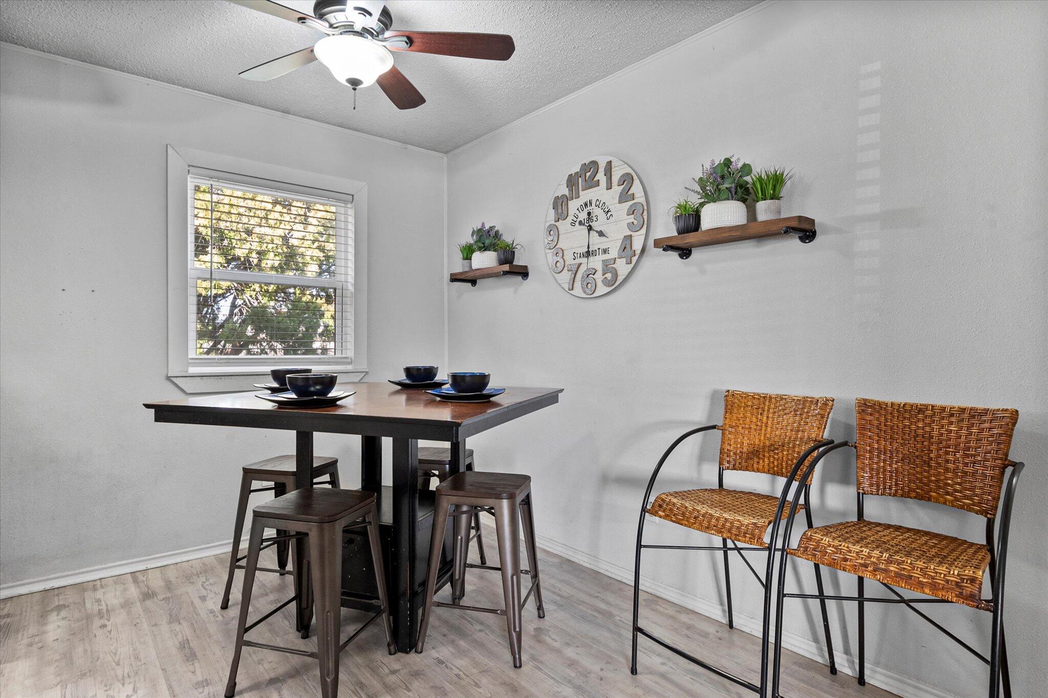 4824 8th Street Lubbock, TX 79416 - Photo 11 of 27 a view of a dining room with furniture and chandelier