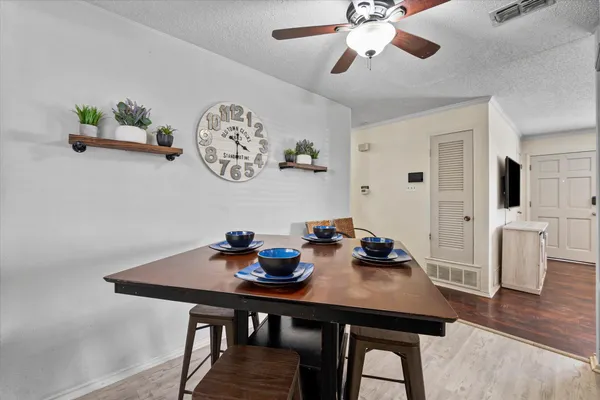 a view of a dining room with furniture and wooden floor