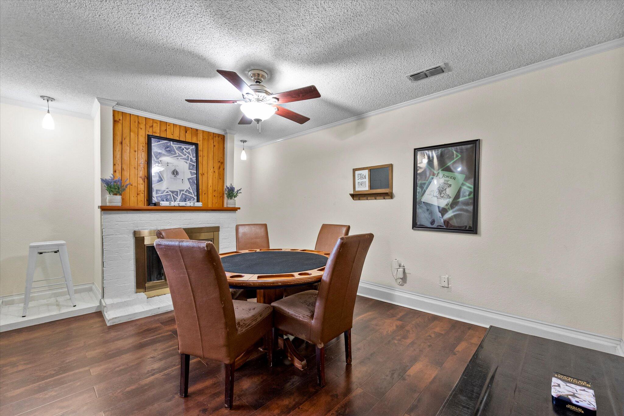 4824 8th Street Lubbock, TX 79416 - Photo 7 of 27 a view of a dining room with furniture window and wooden floor