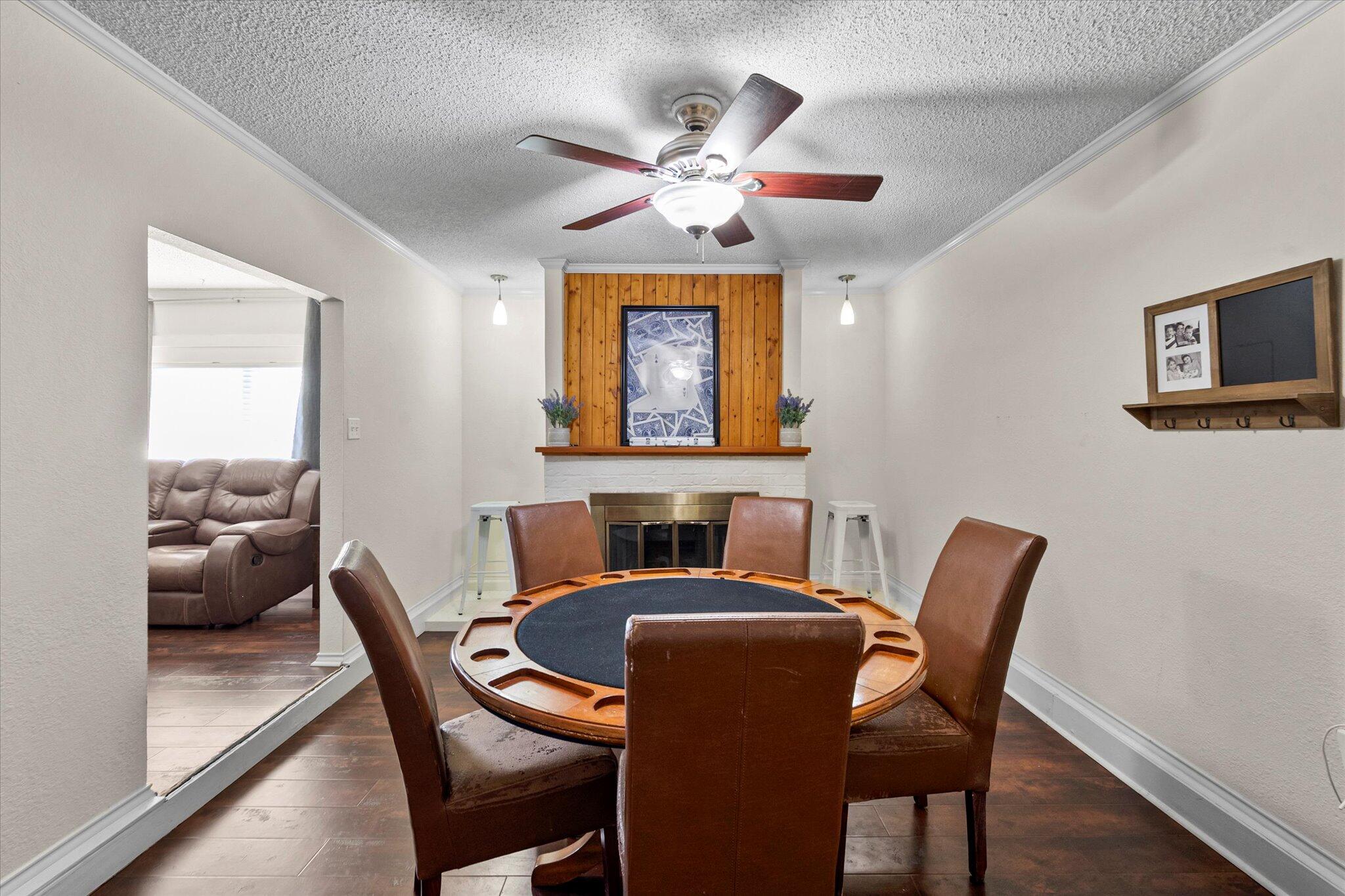 4824 8th Street Lubbock, TX 79416 - Photo 10 of 27 a view of a dining room with furniture and wooden floor