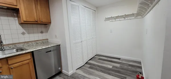 a view of a storage and utility room with washer and dryer