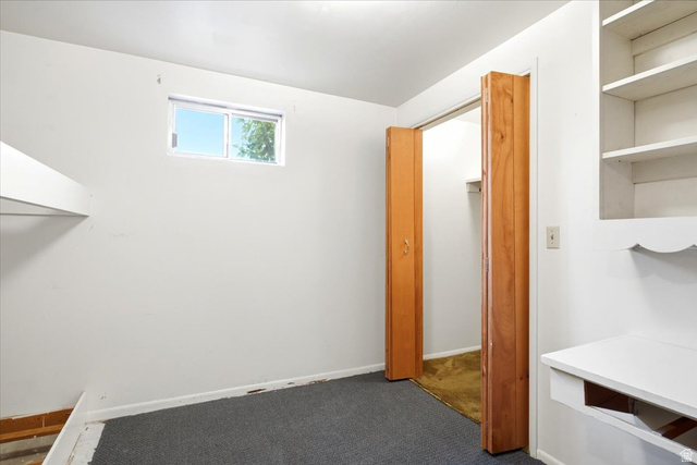 2252 West 800 North Clinton, UT 84015 - Photo 23 of 38 Compact room featuring dark grey carpeting and white painted walls