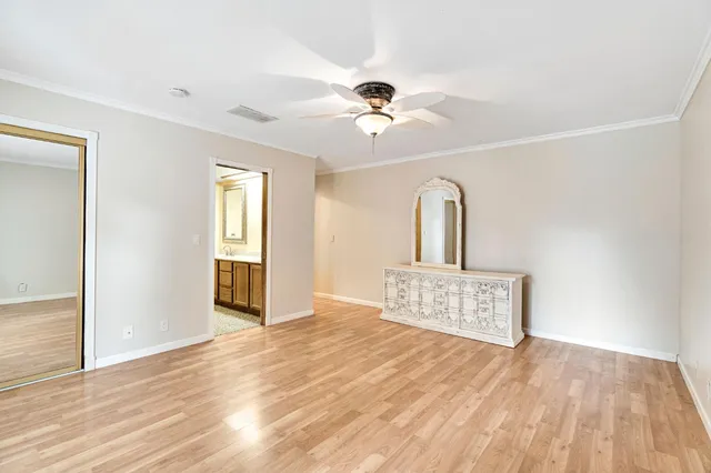 a bathroom with a sink a toilet and a shower