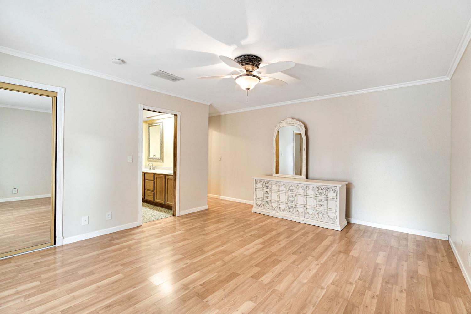 73 Devon Drive Lemoore, CA 93245 - Photo 20 of 32 a view of a room with wooden floor and ceiling fan