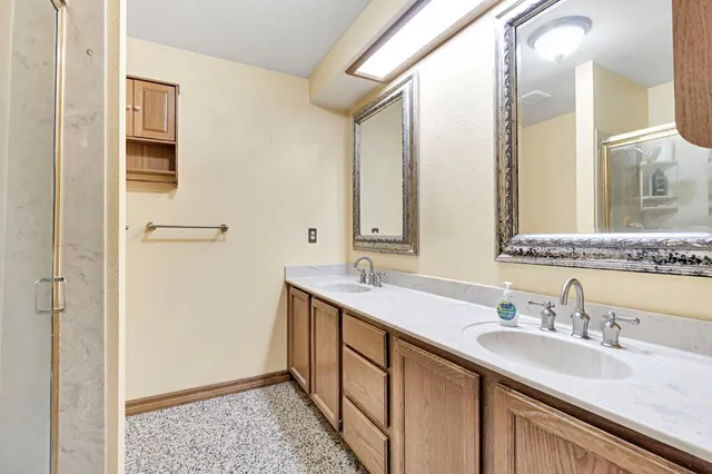 a bedroom with a bed and a table in it