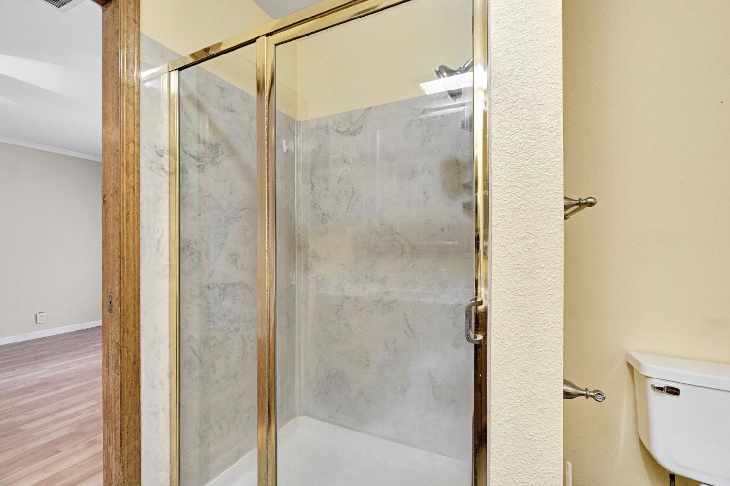 73 Devon Drive Lemoore, CA 93245 - Photo 22 of 32 a bathroom with a shower and a bathroom