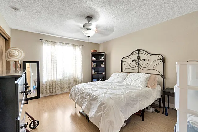 a view of a backyard with sitting area furniture and garden