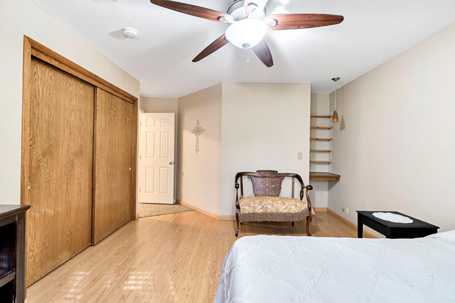73 Devon Drive Lemoore, CA 93245 - Photo 26 of 32 a bedroom with a bed and ceiling fan