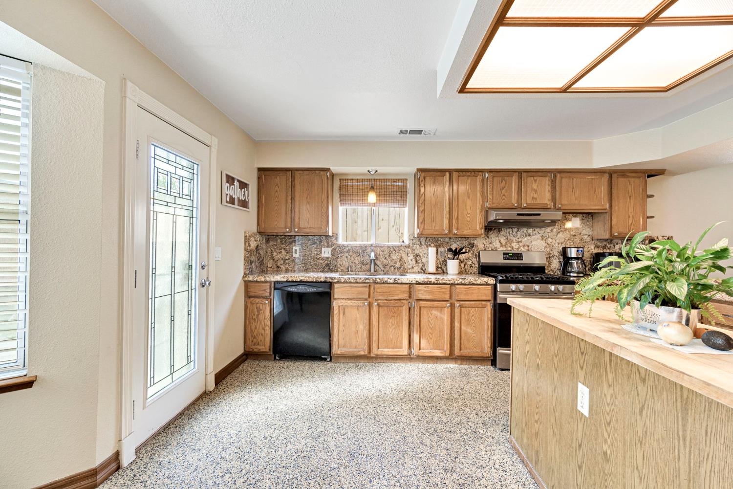 73 Devon Drive Lemoore, CA 93245 - Photo 8 of 32 a kitchen with a refrigerator sink and stove