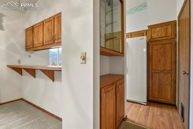 a bathroom with a sink toilet and a mirror