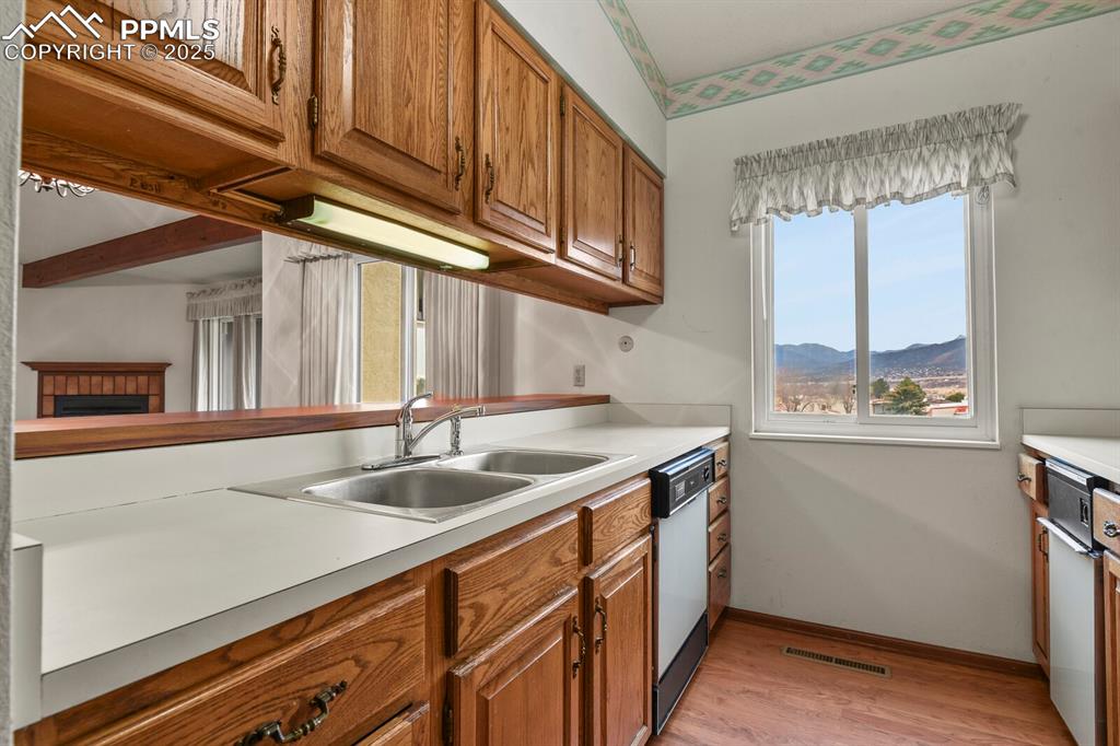1122 Fontmore Road, Unit C Colorado Springs, CO 80904 - Photo 13 of 31 a kitchen with a sink and cabinets